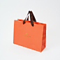 シンプルでも高級感のあるラグジュアリーオレンジの紙袋 | オリジナル紙袋のベリービーバッグ