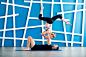Couple practicing acro yoga in a studio. Acro yoga concept. Couple yoga class workout