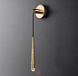 RH Modern's Aquitaine Sconce 21":Inspired by French minimalist lighting of the 1960s, Jonathan Browning's elegant design features a solid brass form suspended from a slender black cord. An inset LED bulb at the tip offers warm, glowing light.: 