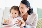 Mother and baby daughter celebrating birthday by Gable Denims on 500px