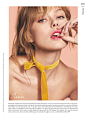 Model Frida Gustavsson wears a berry colored lip gloss