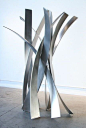 This sculpture has a great sense of movement. I feel like it could go anywhere from a museum to a house. The stainless steel has a really clean feeling.: 