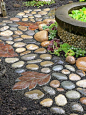Garden path of rocks and stepping stones made from a leaf mold.: 