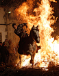 A man rides his horse through flames during the "Luminarias" religious celebration on the eve of Saint Anthony's Day in the village of San Bartolome de los Pinares, Spain on January 16, 2011. According to tradition people from the area ride thei