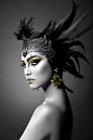 Ancient beauty black feather headdress. and lord that gold makeup. mountainhighunderground.com