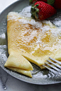 Close up of crepes on a plate.