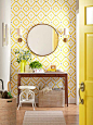 Yellow Entryway, love the wallpaper and all the neutral woven elements | 100+ Beautiful Mudrooms and Entryways at Remodelaholic.com