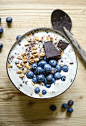 vanilla smoothie bowl with dark chocOlate and fresh blueberries | @andwhatelse