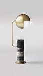 ANOTHER - Table lamp. A marble base table lamp with a rounded projecting arm to one side, topped with an unusual metal shade. The shade has a mobile top, allowing light to transfer according to multiple combinations, e.g. directed to one side or downwards