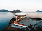 White Concrete Building Beside Body of Water