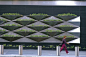 The wall mounted planters at Time Warner Center enhance the pedestrian level facade by incorporating landscaping on the vertical building surface. Photo courtesy Mathews Nielsen: 