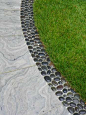 Edging idea, set polished rocks in concrete.