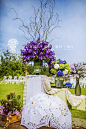 2013年9月9日三亚海棠湾康莱德紫色复古婚礼 By 三亚爱之旅 :  整个婚礼现场以紫色调为主，配以金色点缀，加上复古风味的手提箱和浪漫的留声机，将复古风婚礼诠释得淋漓尽致。