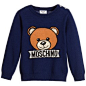 Baby Boys Blue Knitted Teddy Sweater : Baby boys navy blue sweater by Moschino Baby, featuring a large teddy bear on the chest with the designer's logo below. Made in a knitted cotton and wool blend, it is ribbed around the v-neckline, cuffs and hem. It f