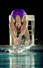 Caucasian swimmer diving off starting block by Gable Denims on 500px
