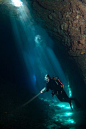 Photo: A diver in a sunlit cave off the coast of Corfu, Greece