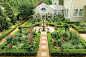 Once a pool, this peaceful English courtyard garden is filled with roses, hollyhocks, and foxgloves. Potted evergreen topiaries lend interest to the parterres when the roses are dormant. It's a slice of British heaven in the Deep South.