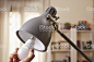 Hand changing a regular light bulb for LED 免版稅 stock photo