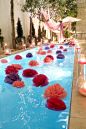 Make poms out of plastic table cloths to float in the pool! Amazing!: 