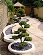 Simple garden design - Japanese zen. I quite like the idea of a trough of stones as a drainage solution too.: 