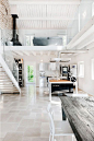 12 Loft Mezzanines: We weren’t able to locate the designer behind this immaculately renovated Italian villa, but we’re ready to move in. The clean lines of the stainless kitchen appliances and cabinetry offset the rustic whitewashed stone wall and farm ta