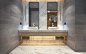 While the rest of the apartment uses fine materials modestly, the bathroom embraces its opulence with conviction. Marble floor and backsplash are sandwiched between bold gray tiles, with brass pendants and golden cove lighting to give a warm and rich appe