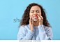 African-American woman with gum inflammation on color background