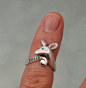 Fawn ring,  silver with green garnets : who can resist baby fawns? this little one is available with green garnets or blue sapphires.(.07ct) the stones can be arranged differently -- such as a stone in the curly que. just let me know and i will give you a