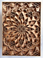 Working with precisely cut 1/8" pieces of laser-cut mahogany plywood, Oakland-based artist Gabriel Schama creates densely layered wood relief sculptures that twist, intersect, and overlap to create various mandala-like forms. Each piece begins as a v