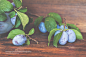 Fresh plums on wooden table. Toned. by Victoria Kondysenko on 500px
