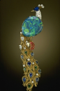 Brooch | Harry Winston.  32 ct black opal from Lightning Ridge (Australia), accented with sapphires, rubies, emeralds, and diamonds set in by ingrid