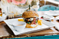 Delicious bacon cheeseburger on a plate at a restaurant