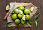 Fresh limes with knife by Ekaterina Fedotova on 500px