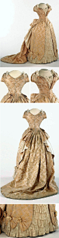 Evening dress, American or French, ca. 1886-87. Pale cream figured silk trimmed with lace. Philadelphia Museum of Art