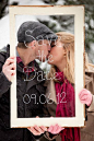 See It Through: Get smoochy with your save-the-date sign by writing it on glass and puckering up behind it.  Photo by Royce Sihlis Photography via Style Me Pretty