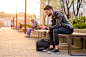 Young man sitting on a bench by Michael Osterrieder on 500px