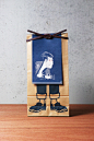 Anything : NOSIGNER designed the package of "Anything," the brand of traditional-Japanese-style aprons. The paper bag, originally used for rice, illustrated with the apron provides an actual image of how to wear it and its lineup.