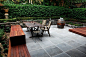 Courtyard in sawn and hewn bluestone with yellow box decking modern-patio