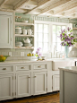 white kitchen with turquoise