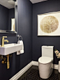 Small transitional black tile and ceramic tile ceramic floor powder room idea in Toronto with a one-piece toilet, blue walls and a wall-mount sink