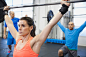 Determined woman doing cross fit in gym