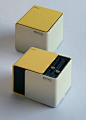 Released in 1970, when Sony had become the first Japanese company to list shares on the New York Stock Exchange. Sliding the faces on this cubic radio reveals a speaker in front and controls on top, a unique design at the time. One version of its packagin