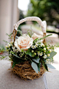 natural and pretty flower arrangement in a rustic basket: