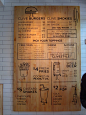 Using wood as the base for a menu board instead of a blackboard is an idea I would consider using