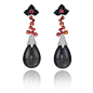 Earrings in 18k white gold with two grey pear shaped moonstone cabochon drops, orange-red sapphires, black onyx and diamonds