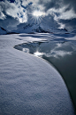 Backlight on the snow by Marco Barone