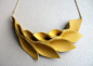 Mustard Yellow Leather Petal Necklace by HaKNiK on Etsy, $32.00.  Could do similar in polymer clay
