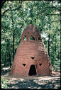 Ceramic hut made for the garden by Laurie Spencer - 'Imaret Dome' was built on private property on Keystone Lake near Tulsa Oklahoma. It is 14 ft. tall and built with 7 tons of clay. The title "Imaret" comes from a Turkish word meaning a resting