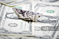 Paper Boat Shaped By Us Dollar Currency On Us Dollars