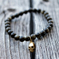 Golden Obsidian Bracelet by LavishLivez - $89 : The very limited edition Golden Obsidian bracelet is a refined variation on a tribal/punk motif. Crafted by lavish-livez  The skull is a 24K vermeil gold and is finished with a brushed technique. All pieces 